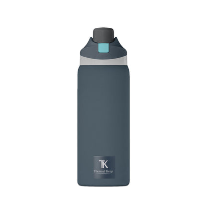 Night Fall Blue water bottle with a black cap and teal label on a white background