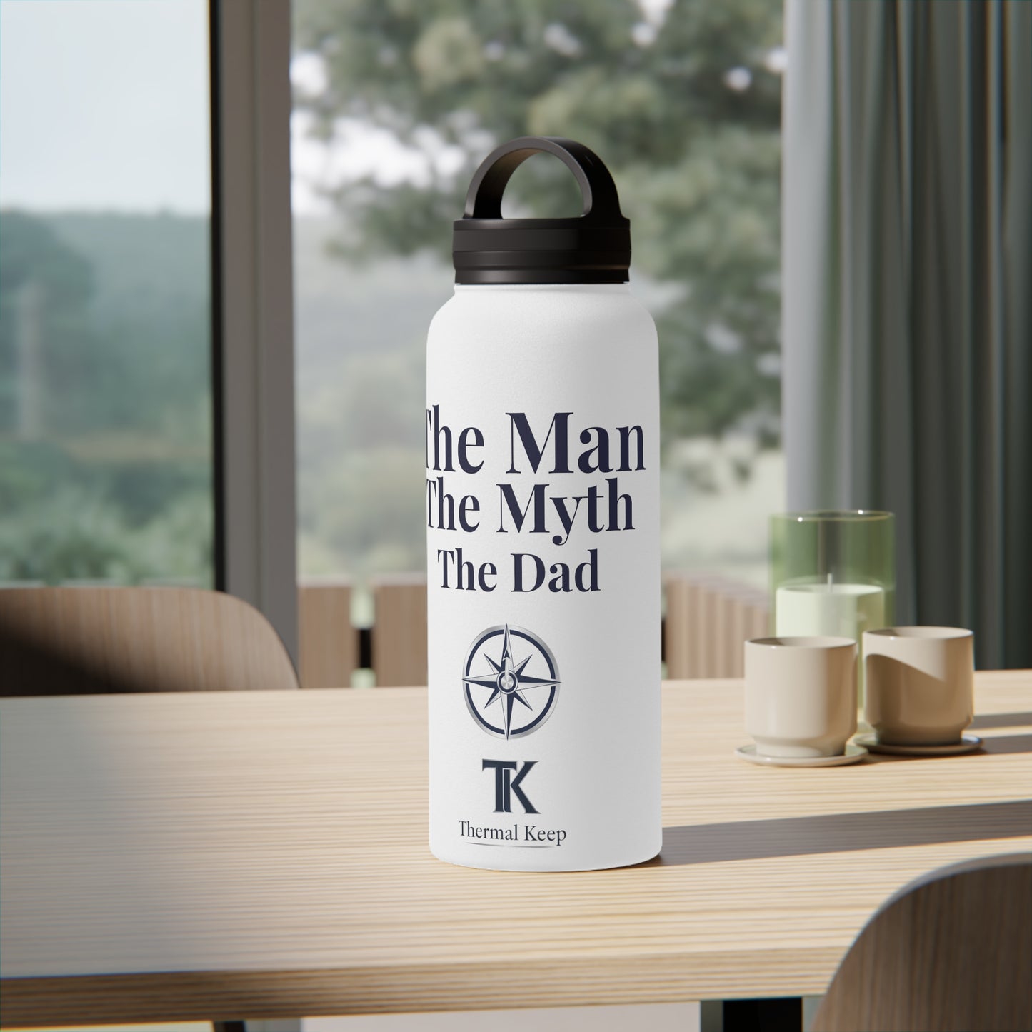 White water bottle with text and logo on a table with a blurred outdoor background