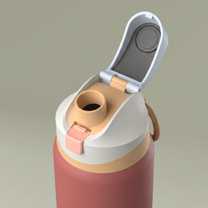 Close-up of a multicolored water bottle with a beige cap on a beige background